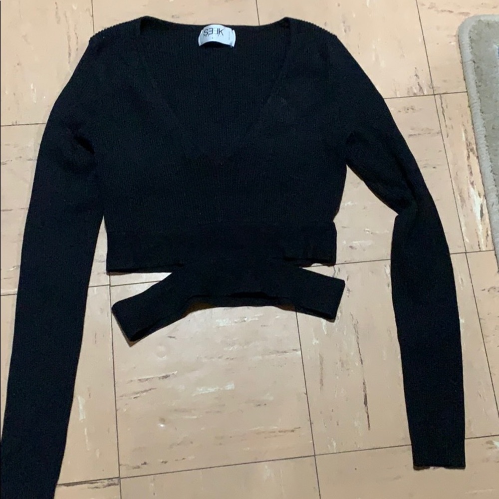 Seek black top with cut out on waist